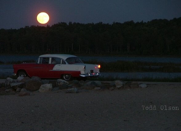Photo of full moon over Chris Rogala's antique car by Todd Olson at Mackinaw Mill Creek Camping in Mackinaw City, MI.