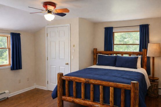 Queen size bedroom of Huron House Rental by Mackinaw Mill Creek Camping in Mackinaw City, MI