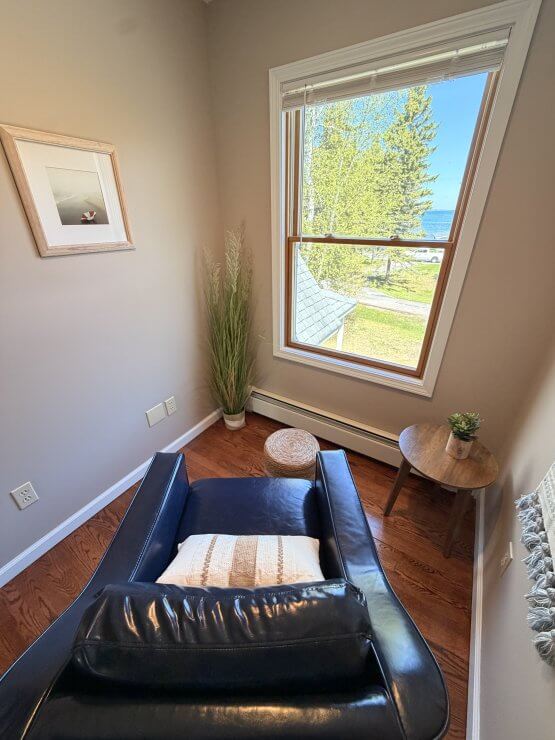 Bedroom chair view Huron House by Mackinaw Mill Creek Camping
