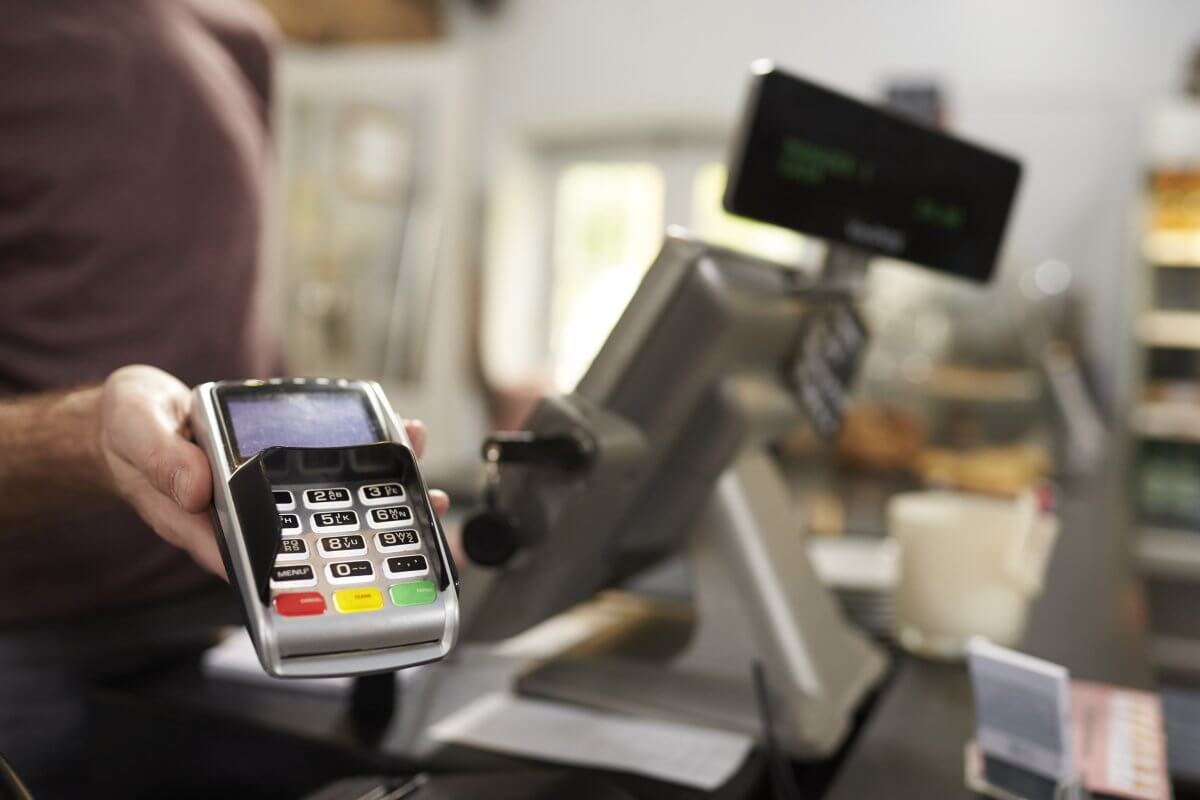 Operate a computerized cash register at The Park Store.