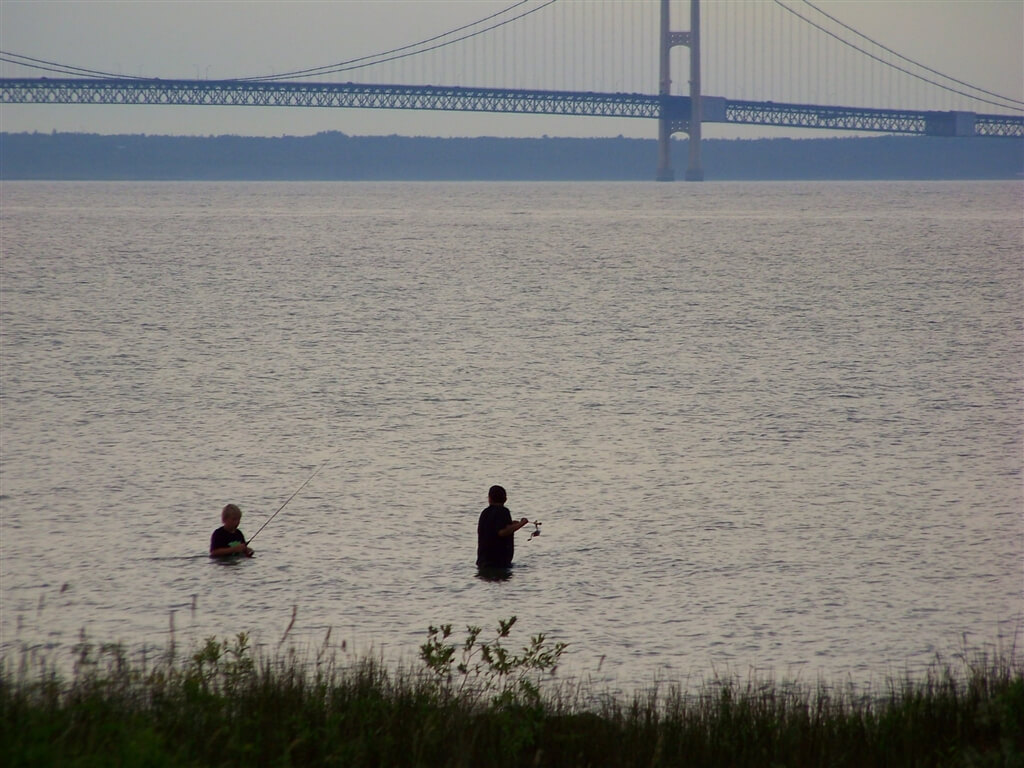 Photo of campers fishing from the shores of Mackinaw Mill Creek Camping in Mackinaw City, MI. © 2016 Frank Rogala.