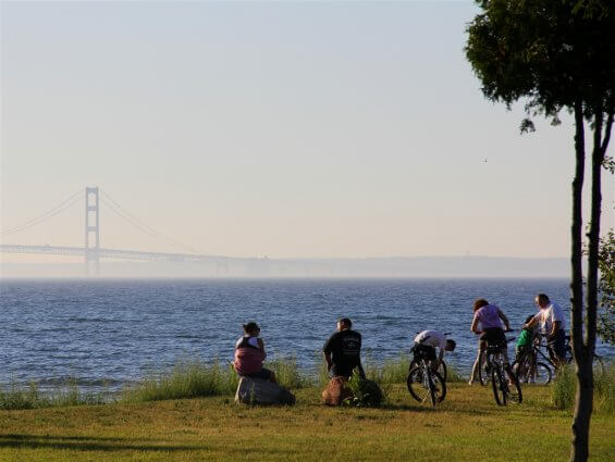 Photo of campers enjoying a view of the Mackinac Bridge from Mackinaw Mill Creek Camping in Mackinaw City, MI. © 2016 Frank Rogala.