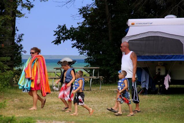 Photo of campers heading to the heated pool at Mackinaw Mill Creek Camping in Mackinaw City, MI. © 2016 Frank Rogala.