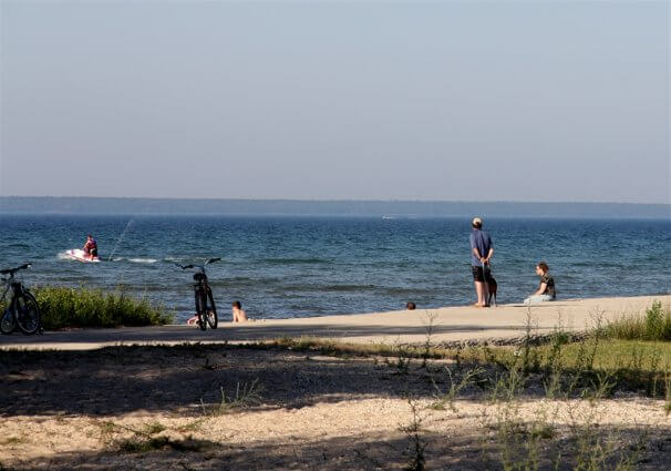 Photo of campers jet skiing near the boat launch at Mackinaw Mill Creek Camping in Mackinaw City, MI. © 2016 Frank Rogala.