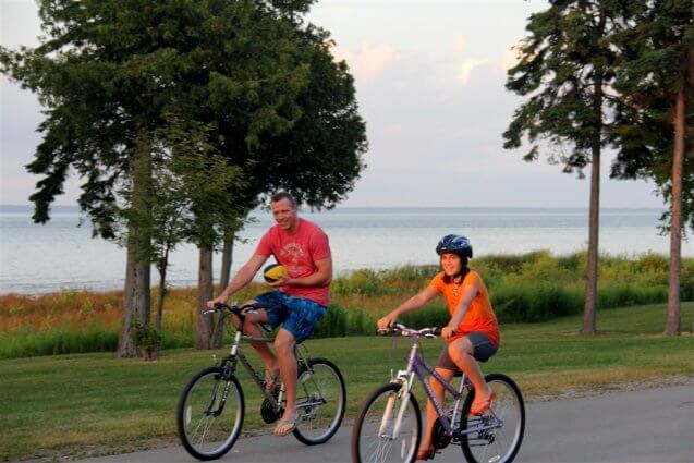 Photo of campers riding bikes at Mackinaw Mill Creek Camping in Mackinaw City, MI. © 2016 Frank Rogala.