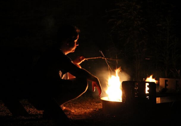 Photo of a campfire in a fire ring at a cabin at Mackinaw Mill Creek Camping in Mackinaw City, MI. © 2016 Frank Rogala.