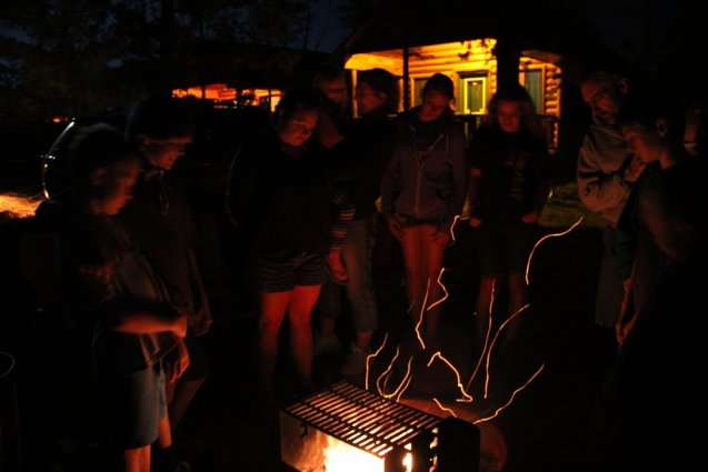 Photo of a campfire in a cabin fire ring at Mackinaw Mill Creek Camping in Mackinaw City, MI. © 2016 Frank Rogala.