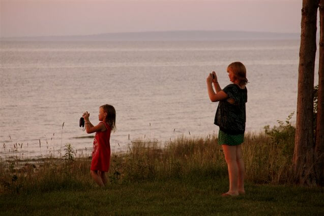Photo of campers taking pictures of the view from Mackinaw Mill Creek Camping in Mackinaw City, MI. © 2016 Frank Rogala.