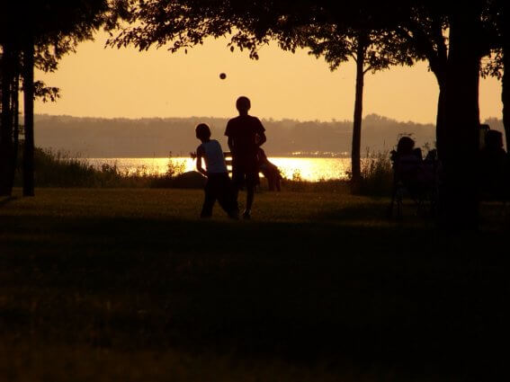 Photo of kids playing at sunset at Mackinaw Mill Creek Camping in Mackinaw City, MI. © 2016 Frank Rogala.