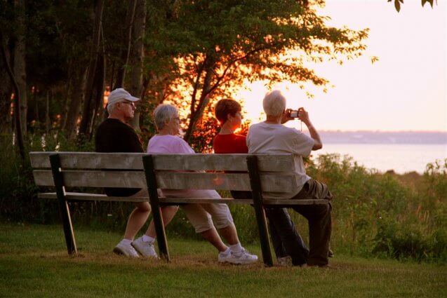 Photo of a shoreline sunset from a bench at Mackinaw Mill Creek Camping in Mackinaw City, MI. © 2016 Frank Rogala.