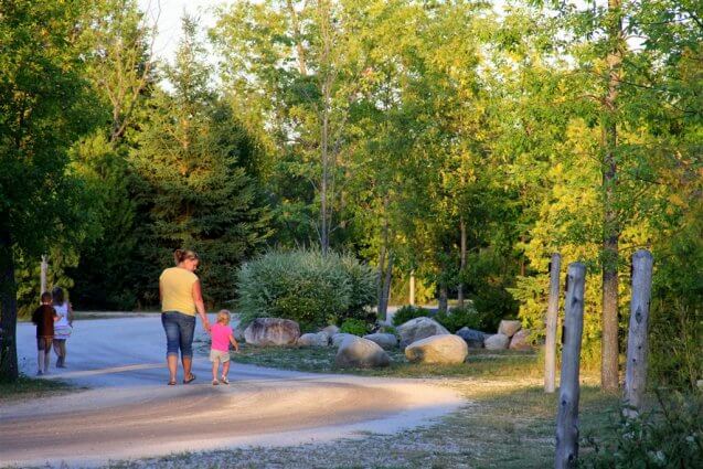 Photo of mother and child going for a walk at Mackinaw Mill Creek Camping in Mackinaw City, MI. © 2016 Frank Rogala.